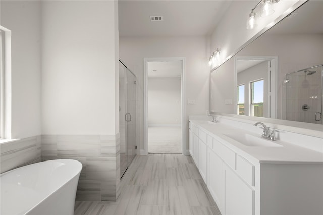 2413 Rams Horn, Waxahachie, TX 75167 - full bath with a soaking tub, a stall shower, and double vanity