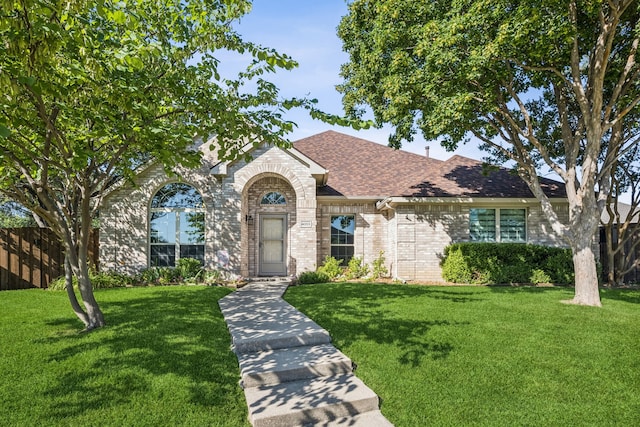 4003 Randall Ln, Carrollton, TX 75007 - view of front of property featuring brick siding and roof with shingles