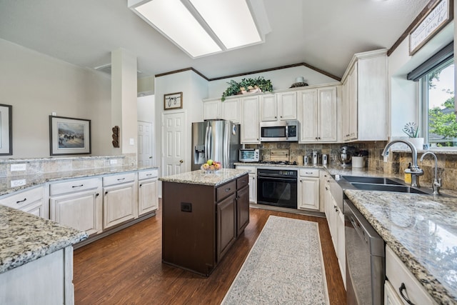 4003 Randall Ln, Carrollton, TX 75007 - kitchen with stainless steel appliances, dark wood-style flooring, light stone countertops, vaulted ceiling, and decorative backsplash