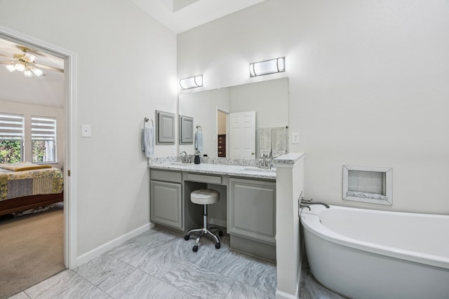 4003 Randall Ln, Carrollton, TX 75007 - full bathroom with a freestanding tub, double vanity, ensuite bath, and ceiling fan