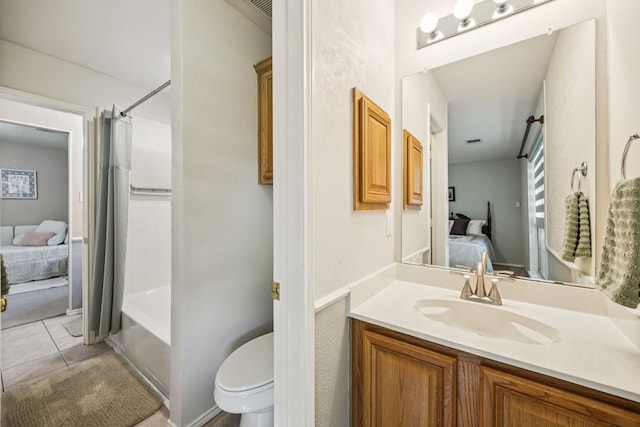 4003 Randall Ln, Carrollton, TX 75007 - ensuite bathroom featuring vanity, shower / bathtub combination with curtain, and tile patterned floors