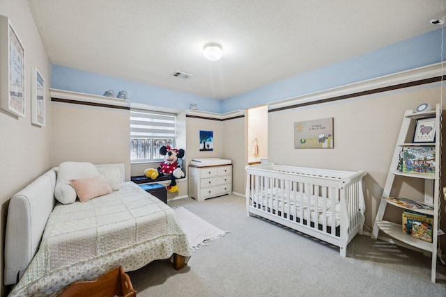 4003 Randall Ln, Carrollton, TX 75007 - carpeted bedroom featuring a textured ceiling