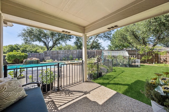 4003 Randall Ln, Carrollton, TX 75007 - fenced backyard with a patio area
