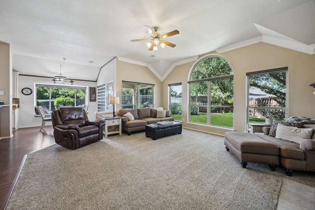 4003 Randall Ln, Carrollton, TX 75007 - living area featuring lofted ceiling, healthy amount of natural light, a ceiling fan, ornamental molding, and wood finished floors