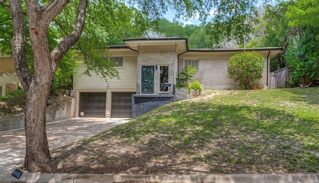 4105 Micki Lynn Ave, Fort Worth, TX 76107 - view of front of home featuring an attached garage, driveway, and brick siding