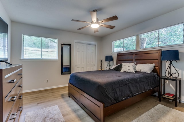 4105 Micki Lynn Ave, Fort Worth, TX 76107 - bedroom with light wood finished floors, a closet, and a ceiling fan