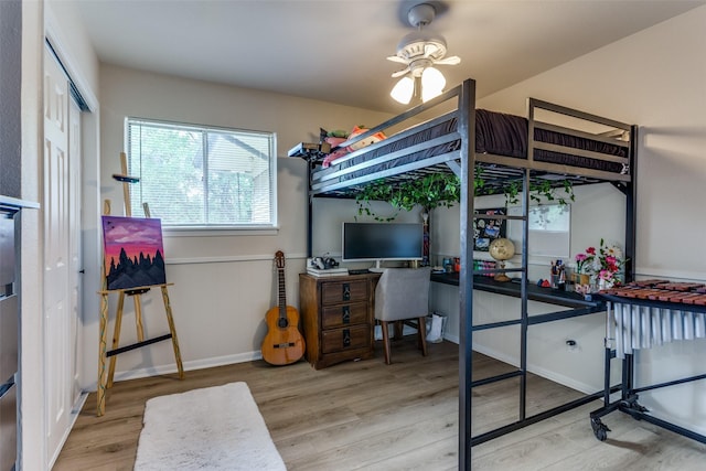 4105 Micki Lynn Ave, Fort Worth, TX 76107 - bedroom featuring wood finished floors, a desk, and a closet