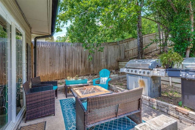4105 Micki Lynn Ave, Fort Worth, TX 76107 - fenced backyard with grilling area, a patio, and an outdoor living space with a fire pit