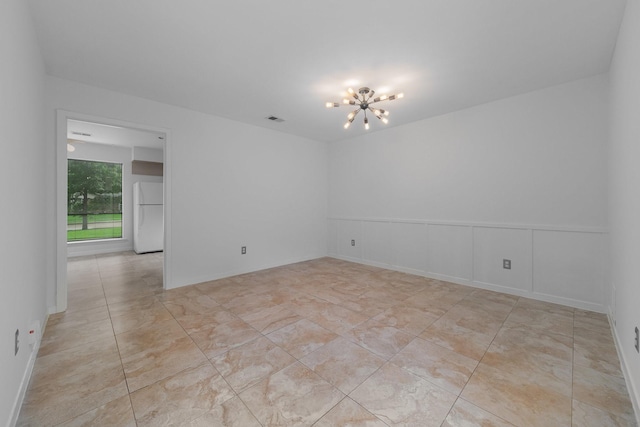 1705 Yorkshire Dr, Richardson, TX 75082 - tiled spare room with a chandelier