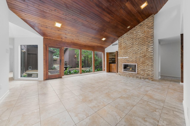 1705 Yorkshire Dr, Richardson, TX 75082 - unfurnished living room with wood ceiling, high vaulted ceiling, an outdoor brick fireplace, and tile patterned floors