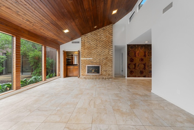 1705 Yorkshire Dr, Richardson, TX 75082 - unfurnished living room with wooden ceiling, high vaulted ceiling, an outdoor brick fireplace, and recessed lighting