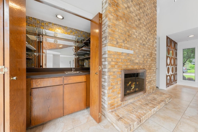 1705 Yorkshire Dr, Richardson, TX 75082 - indoor wet bar featuring a fireplace and tile patterned floors