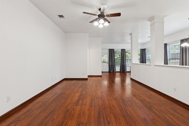 2930 Coteau Way, Dallas, TX 75227 - unfurnished living room featuring decorative columns, ceiling fan, and wood finished floors