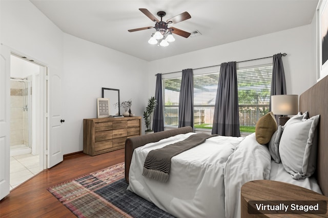 2930 Coteau Way, Dallas, TX 75227 - bedroom with wood finished floors, ensuite bathroom, and ceiling fan