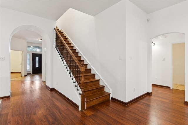 2930 Coteau Way, Dallas, TX 75227 - staircase featuring wood finished floors and arched walkways
