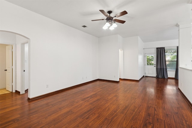 2930 Coteau Way, Dallas, TX 75227 - empty room featuring ceiling fan, arched walkways, and wood finished floors