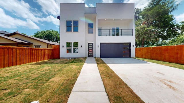 3418 Borger St, Dallas, TX 75212 - contemporary home with a balcony, driveway, stucco siding, and a garage