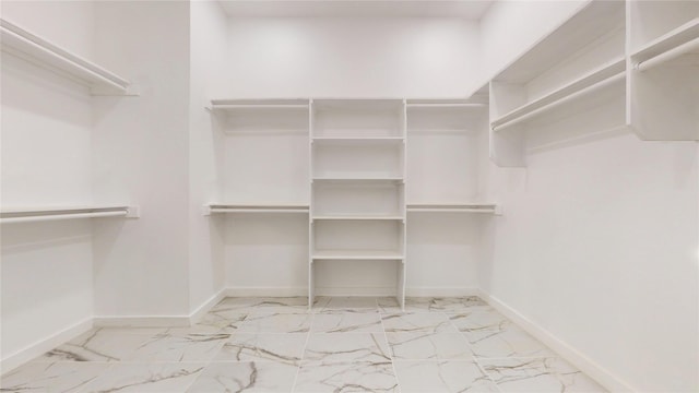 3418 Borger St, Dallas, TX 75212 - walk in closet featuring marble look tiles