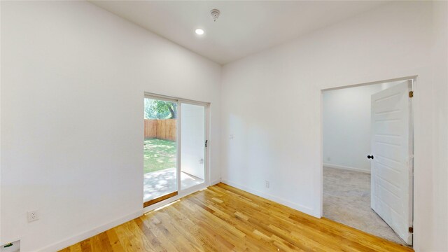3418 Borger St, Dallas, TX 75212 - empty room featuring fire sprinkler in ceiling and light wood finished floors