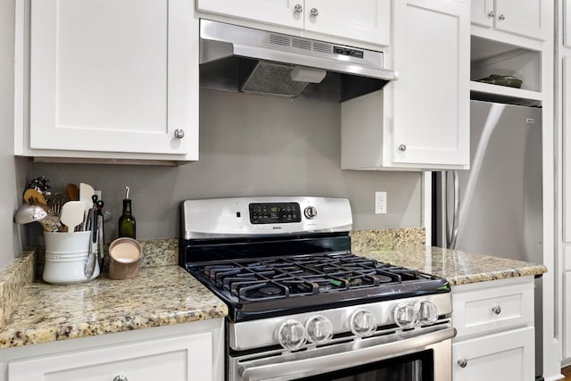 5610 Vanderbilt Ave, Dallas, TX 75206 - kitchen featuring stainless steel appliances, under cabinet range hood, white cabinets, and light stone counters