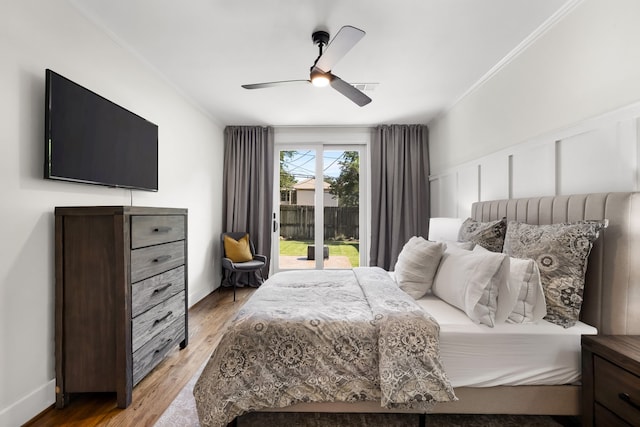 5610 Vanderbilt Ave, Dallas, TX 75206 - bedroom with access to outside, ornamental molding, light wood finished floors, ceiling fan, and a wainscoted wall