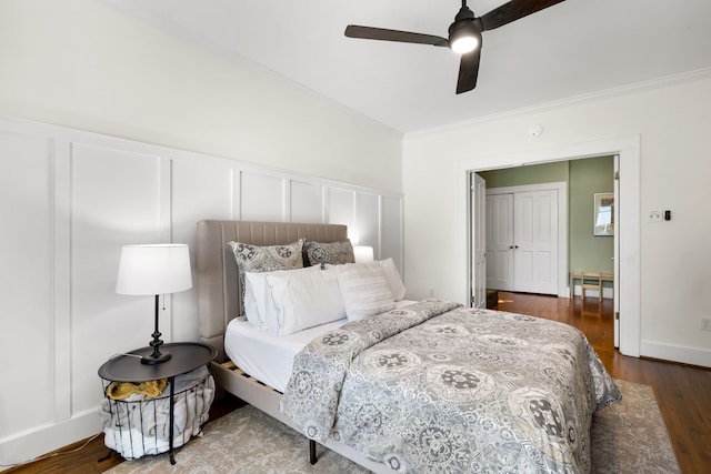 5610 Vanderbilt Ave, Dallas, TX 75206 - bedroom with ornamental molding, a decorative wall, wood finished floors, ceiling fan, and a wainscoted wall