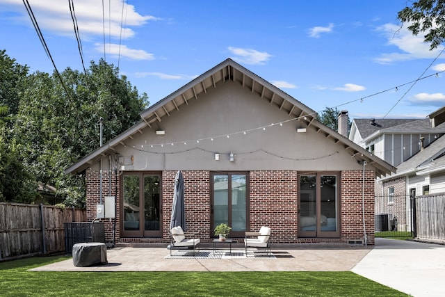 5610 Vanderbilt Ave, Dallas, TX 75206 - rear view of property featuring brick siding and a patio area