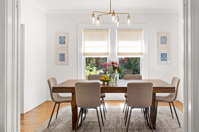 5610 Vanderbilt Ave, Dallas, TX 75206 - dining space featuring wood finished floors, ornamental molding, and a chandelier