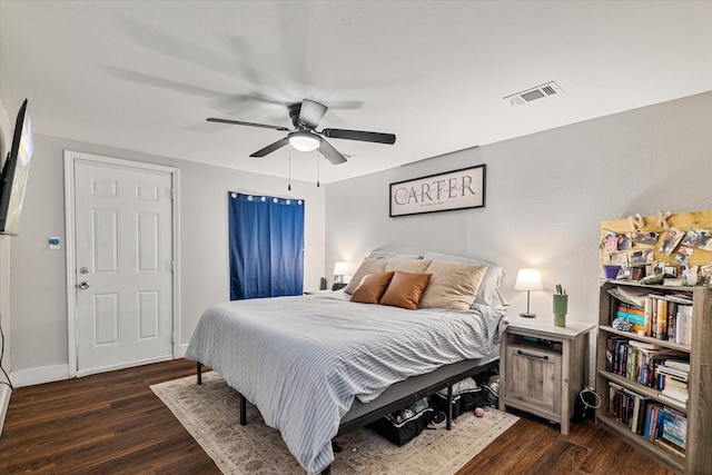 25 W Parnell St, Denison, TX 75020 - bedroom with dark wood-style floors and a ceiling fan
