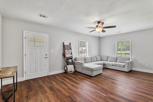 25 W Parnell St, Denison, TX 75020 - living room featuring dark wood-type flooring and ceiling fan