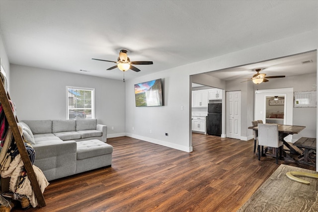 25 W Parnell St, Denison, TX 75020 - living area featuring ceiling fan and dark wood-type flooring