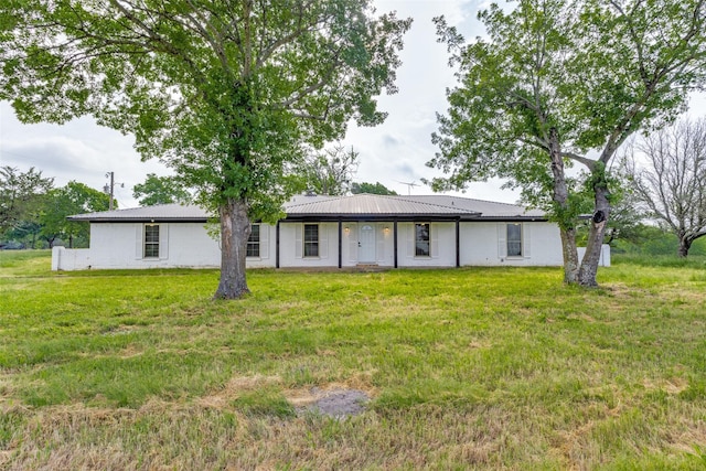 738 Campground Rd, Sherman, TX 75090 - rear view of house featuring a lawn and a metal roof