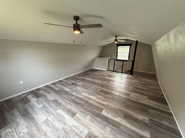 738 Campground Rd, Sherman, TX 75090 - additional living space with a ceiling fan, lofted ceiling, and dark wood-style flooring