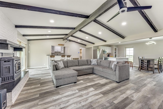 738 Campground Rd, Sherman, TX 75090 - living area featuring recessed lighting, light wood-style flooring, a wood stove, and a ceiling fan