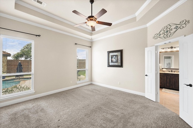 7202 Cattle Barron Ct, Midlothian, TX 76065 - unfurnished room with a tray ceiling, ornamental molding, plenty of natural light, light carpet, and ceiling fan