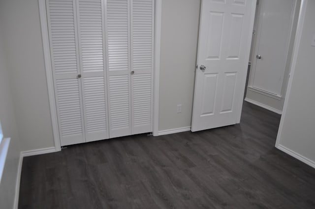 110 Myrtle Ave, Waxahachie, TX 75165 - unfurnished bedroom featuring a closet and dark wood-style flooring