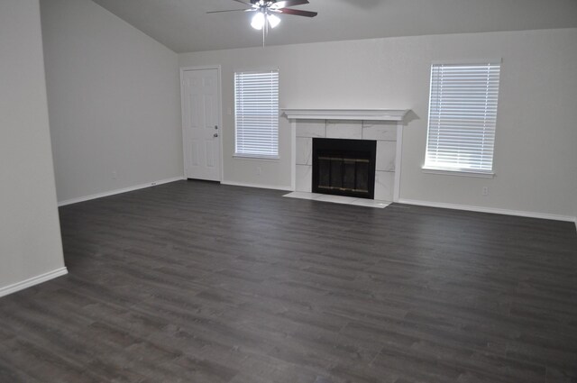 110 Myrtle Ave, Waxahachie, TX 75165 - unfurnished living room featuring ceiling fan, a tile fireplace, dark wood finished floors, and vaulted ceiling