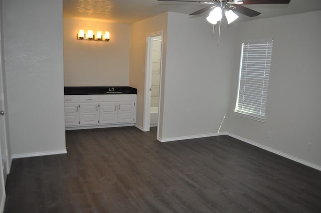 110 Myrtle Ave, Waxahachie, TX 75165 - unfurnished bedroom featuring dark wood-style flooring and a ceiling fan
