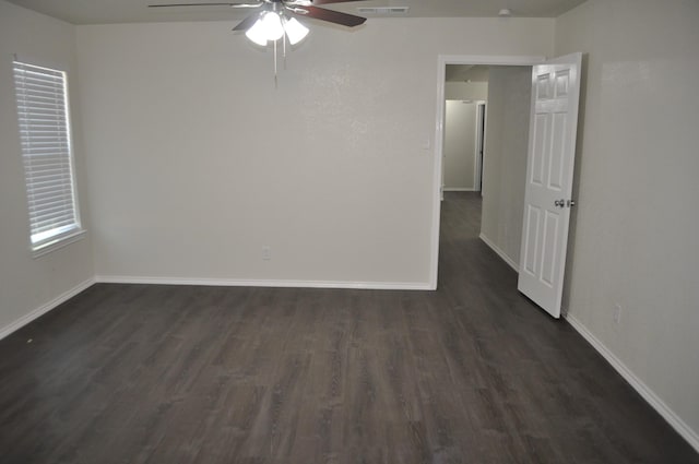 110 Myrtle Ave, Waxahachie, TX 75165 - empty room with a ceiling fan and dark wood-style floors