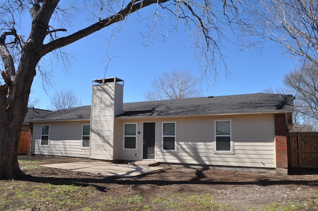 110 Myrtle Ave, Waxahachie, TX 75165 - back of house with a chimney and a patio