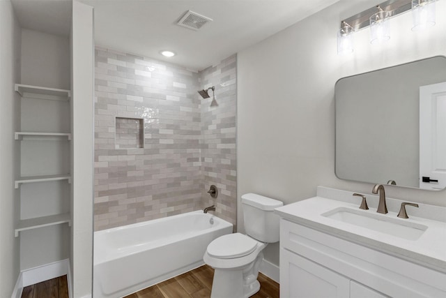 2917 NW Loraine St, Fort Worth, TX 76106 - bathroom featuring wood finished floors, vanity, shower / tub combination, and recessed lighting