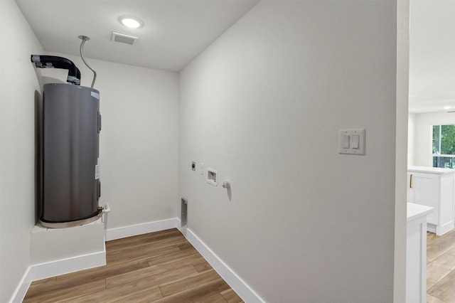 2917 NW Loraine St, Fort Worth, TX 76106 - washroom featuring hookup for an electric dryer, light wood finished floors, electric water heater, hookup for a washing machine, and recessed lighting