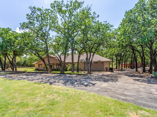 5403 Oakridge Rd, Joshua, TX 76058 - view of front facade featuring driveway, an attached garage, a front yard, and brick siding