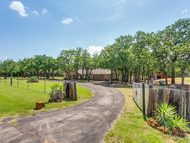 5403 Oakridge Rd, Joshua, TX 76058 - view of asphalt driveway with a gated entry