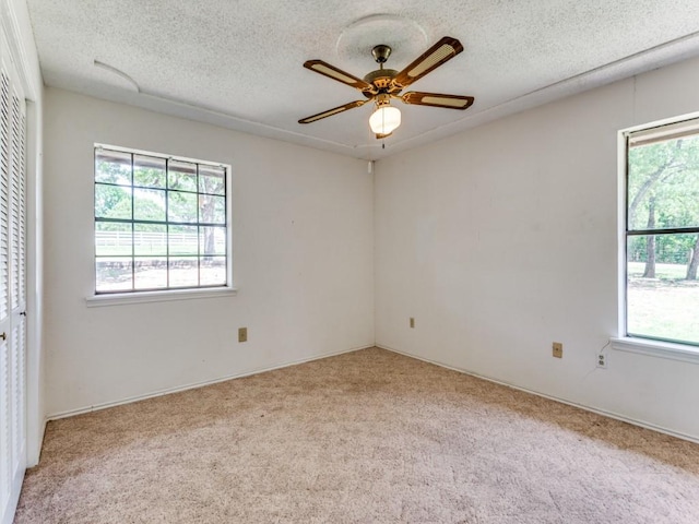 5403 Oakridge Rd, Joshua, TX 76058 - carpeted spare room featuring a textured ceiling and ceiling fan