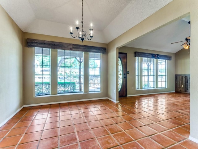 5403 Oakridge Rd, Joshua, TX 76058 - unfurnished dining area featuring a chandelier, tile patterned floors, a ceiling fan, lofted ceiling, and a textured ceiling