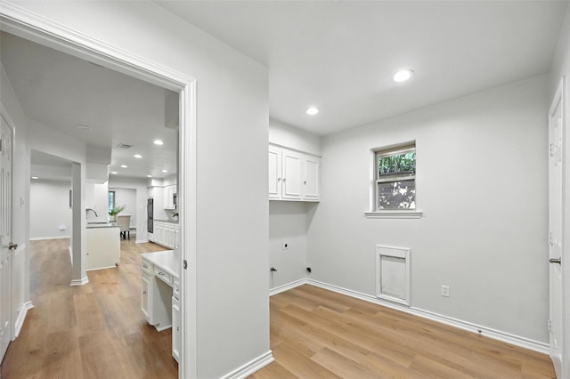 7407 Authon Dr, Dallas, TX 75248 - washroom featuring cabinet space, light wood-type flooring, hookup for an electric dryer, and recessed lighting