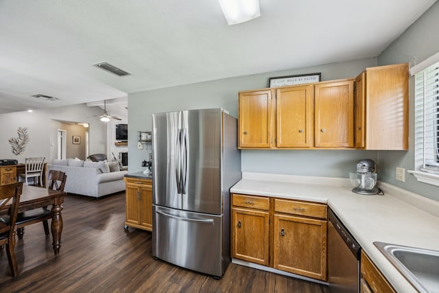 1502 Bette Dr, Mesquite, TX 75149 - kitchen featuring stainless steel appliances, dark wood-style flooring, light countertops, and a ceiling fan