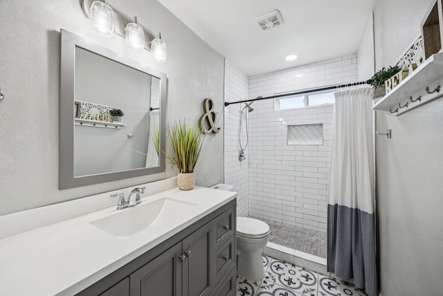 1502 Bette Dr, Mesquite, TX 75149 - bathroom with vanity, a tile shower, and tile patterned floors