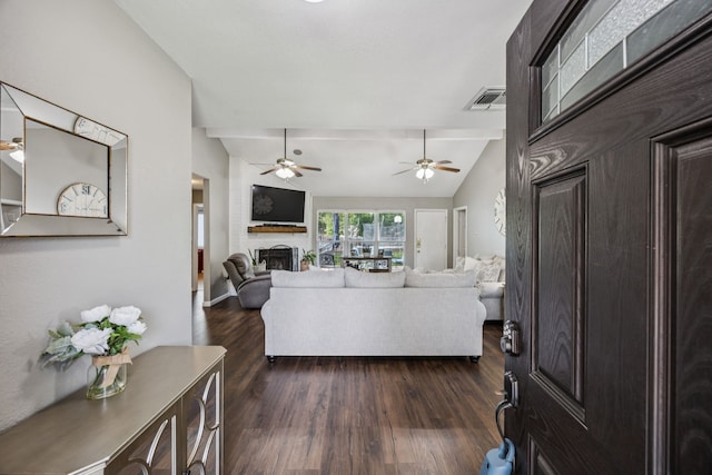 1502 Bette Dr, Mesquite, TX 75149 - living area with a large fireplace, dark wood-type flooring, a ceiling fan, and vaulted ceiling